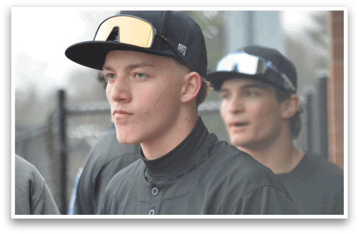 A group of young men wearing baseball uniforms are standing on a field. AI generated content