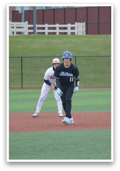 Two baseball players are on the field, one wearing a blue helmet and the other wearing a red helmet. They are both holding baseball bats and appear to be getting ready to play. AI generated content