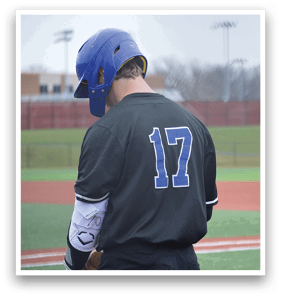 A baseball player wearing a black jersey with the number 17 on the back. AI generated content