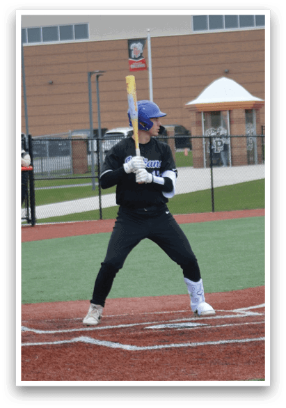 A baseball player is at bat, holding a bat and preparing to swing. AI generated content