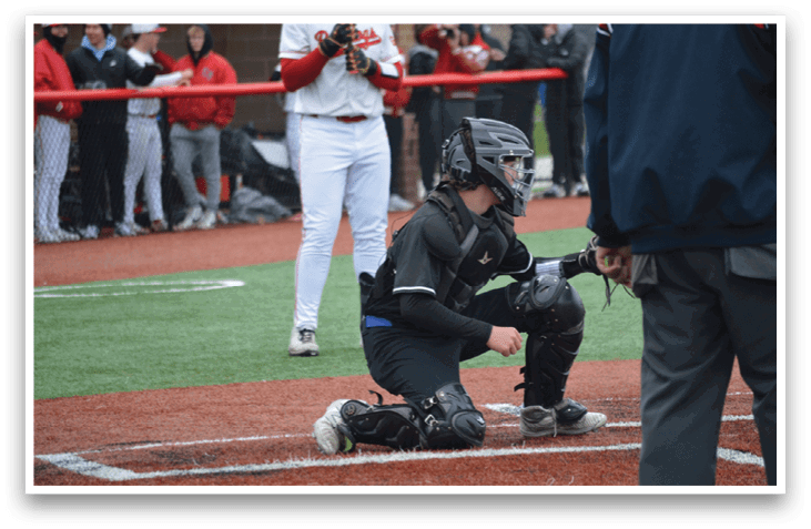 A baseball catcher is kneeling on the ground, wearing a baseball glove. AI generated content