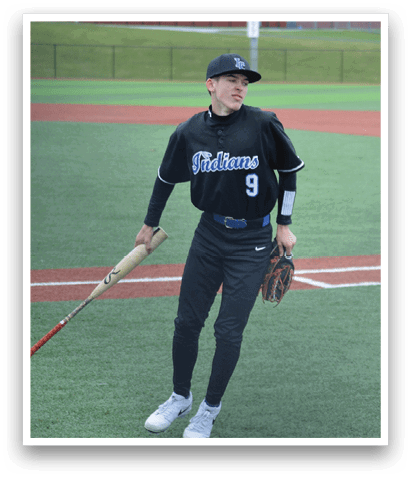 A baseball player in a black jersey holding a bat on a field. AI generated content