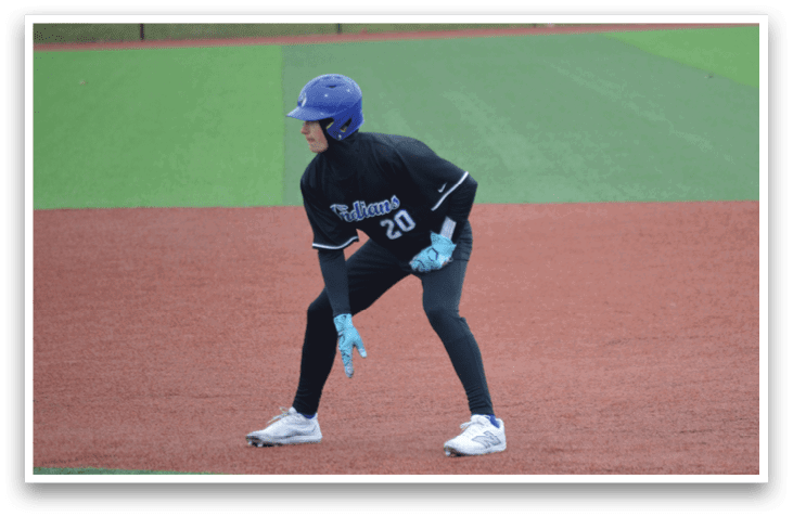 A baseball player wearing a blue helmet and black uniform is standing on the field. AI generated content
