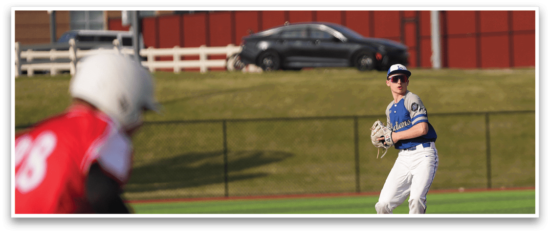 Two baseball players on a field, one wearing a red jersey and the other wearing a blue jersey. A car is parked in the background. AI generated content