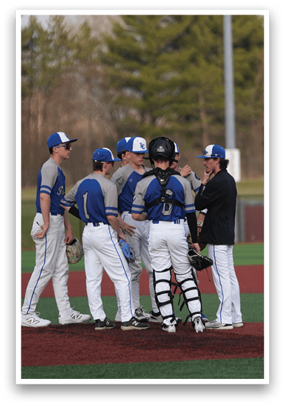 A group of baseball players wearing blue and white uniforms are standing on a field. AI generated content