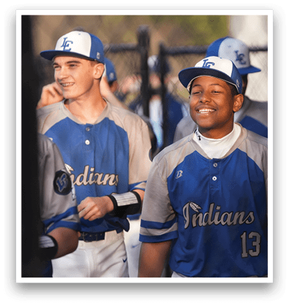 Two baseball players wearing blue and white uniforms with the word Indians on them. AI generated content