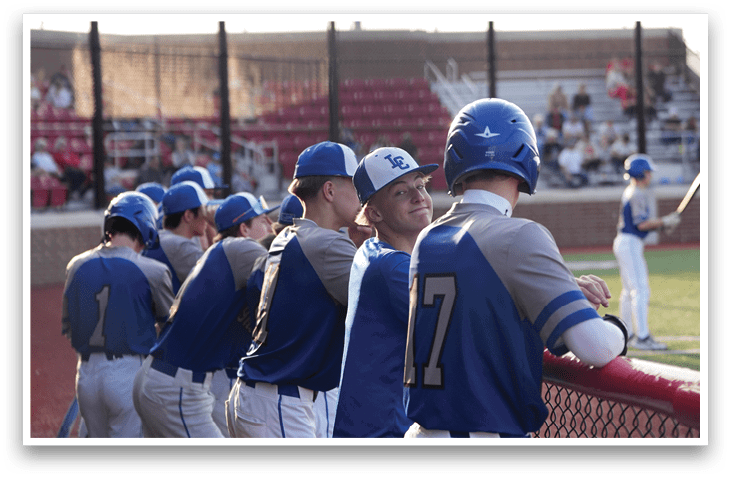 Baseball players wearing blue and grey uniforms are standing on a field. AI generated content