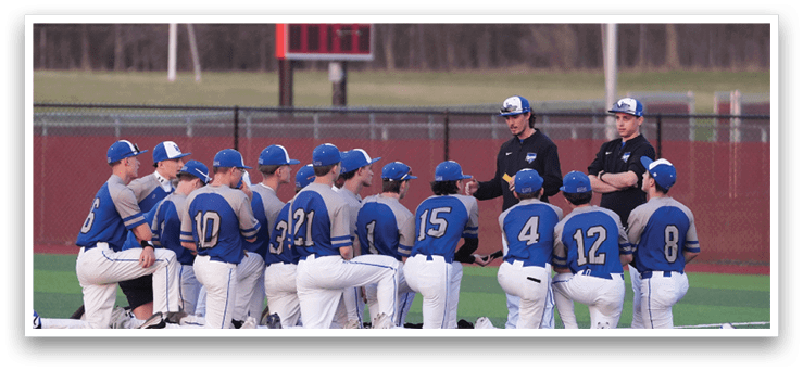 A group of baseball players wearing blue and grey uniforms are sitting on the grass. AI generated content