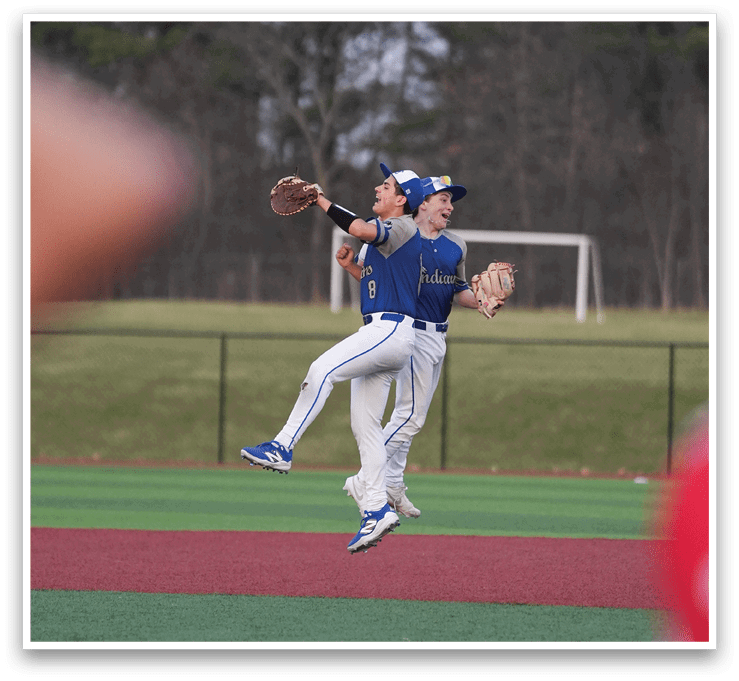 Two baseball players jumping in the air to catch a ball. AI generated content