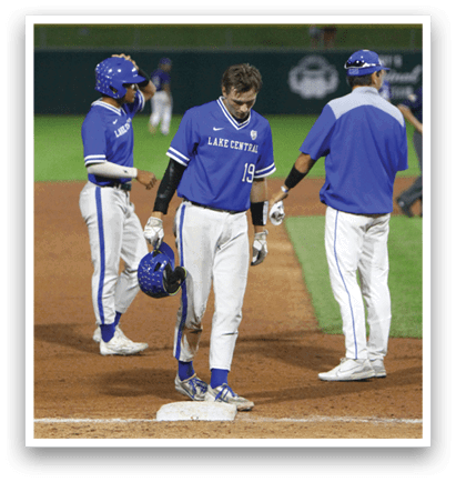 A baseball player slides into a base. Description generated by AI