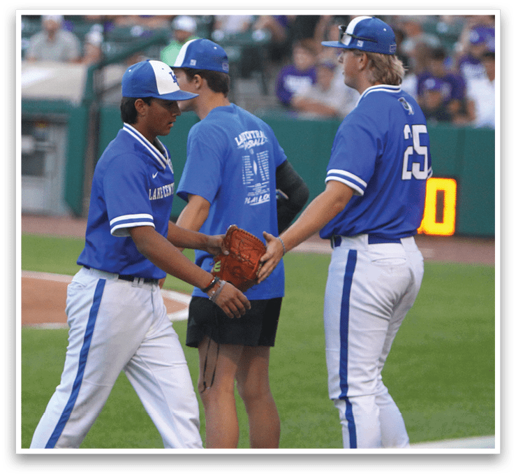 A group of baseball players celebrating on the field. Description generated by AI
