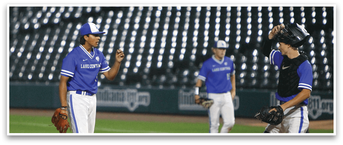 A baseball player wearing a blue helmet and black jersey. Description generated by AI