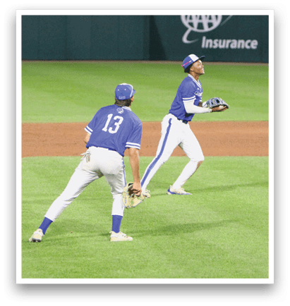 A baseball player slides into a base. Description generated by AI