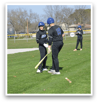 Two people are playing baseball on a field. One person is holding a bat, and the other is holding a baseball glove. They are standing in the grass, and there is a baseball on the ground. AI generated content