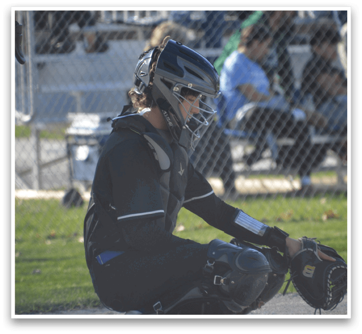 A person wearing a baseball glove is sitting on the ground. AI generated content