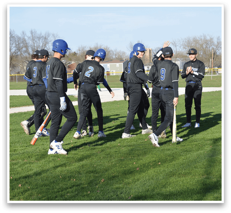 A group of baseball players huddled together on a field, some holding bats. AI generated content