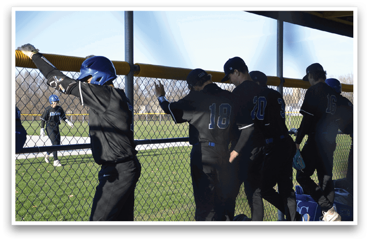 Baseball players wearing black uniforms and helmets are standing in the dugout. AI generated content