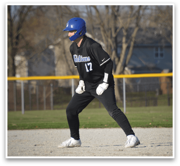 A baseball player wearing a blue helmet and black uniform is running towards a base. AI generated content