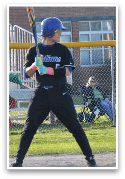 A woman in a black shirt and blue helmet is holding a baseball bat, preparing to swing at a pitch. AI generated content
