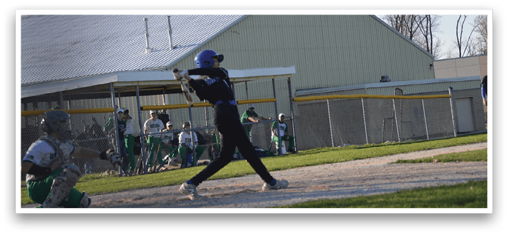 A baseball player in a black shirt and blue helmet is swinging a bat at a ball. AI generated content