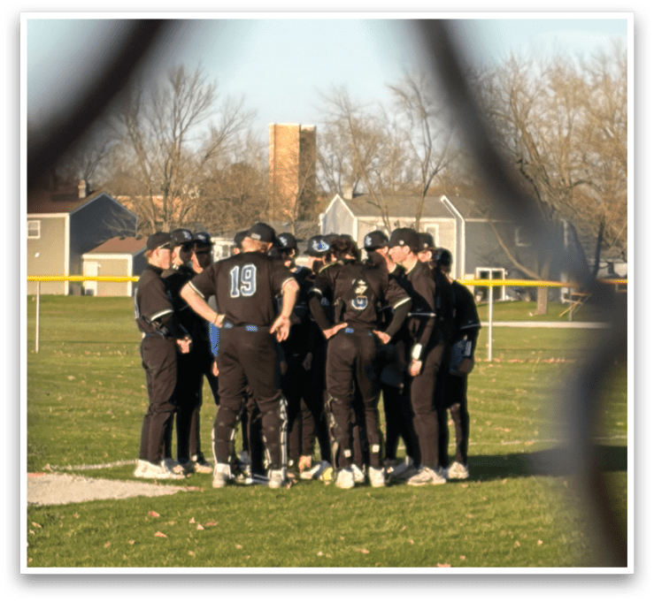 A group of baseball players huddled together on a field. AI generated content