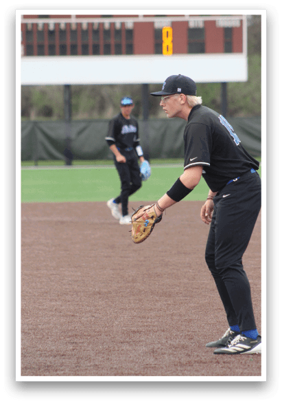 A baseball player in a black uniform is holding a catcher's mitt, ready to catch the ball. AI generated content