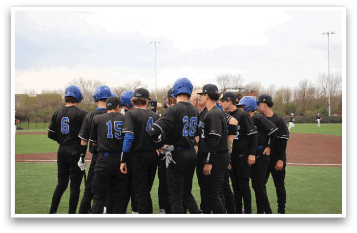 Baseball players wearing black uniforms and blue helmets huddle on the field. AI generated content