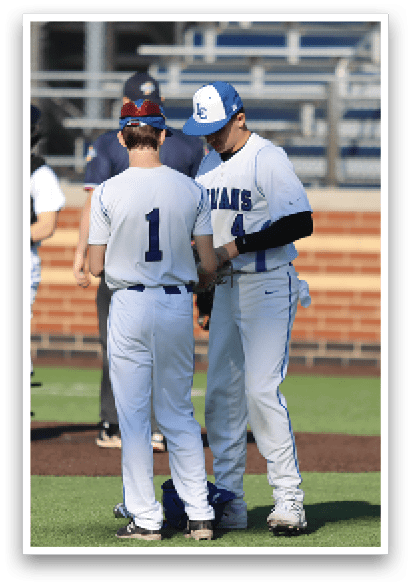 Two baseball players wearing white uniforms are talking to each other on the field. AI generated content
