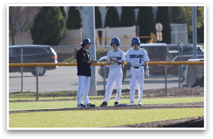 Baseball players on a field, one wearing a blue helmet. AI generated content