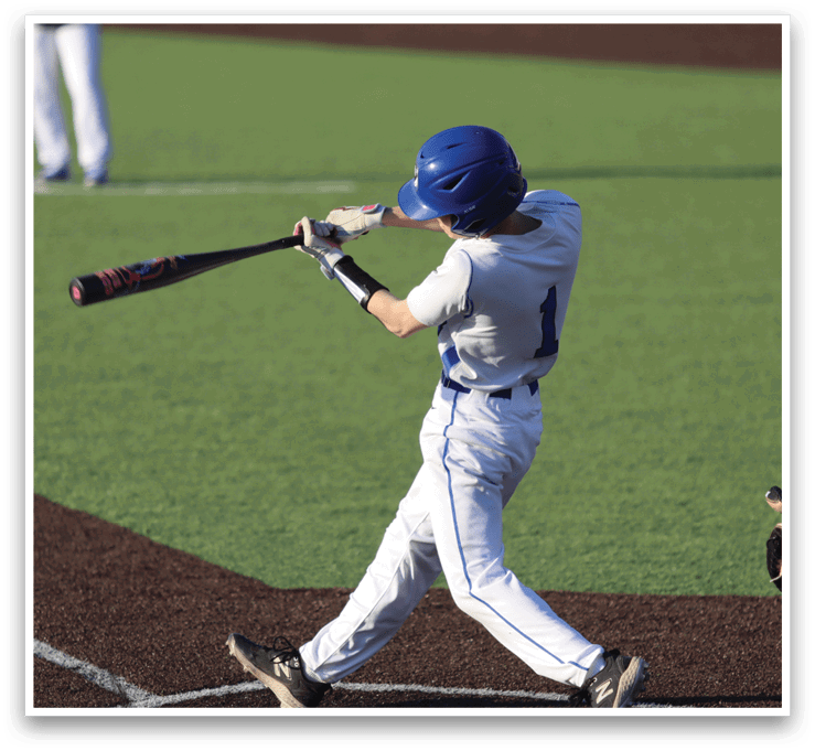 A baseball player in a white uniform is swinging a bat at a ball. AI generated content