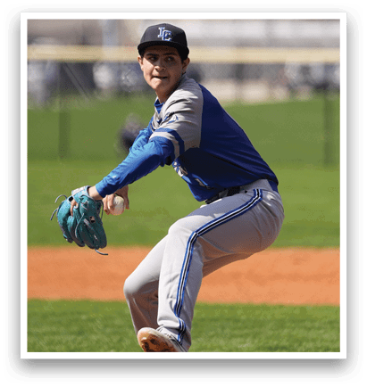 A baseball player in a blue and grey uniform is pitching a ball on a field. AI generated content