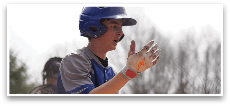 A baseball player wearing a blue and white uniform stands on the field, holding his glove up to his face. AI generated content