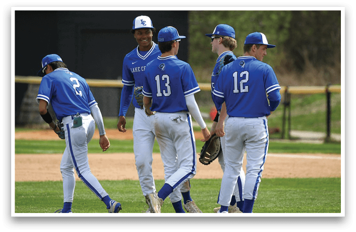 Four baseball players wearing blue uniforms are walking on a field. AI generated content