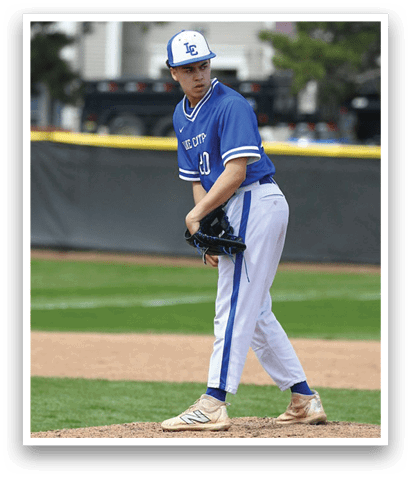 A baseball player in a blue shirt and white pants is on the pitcher's mound, holding a baseball glove. AI generated content