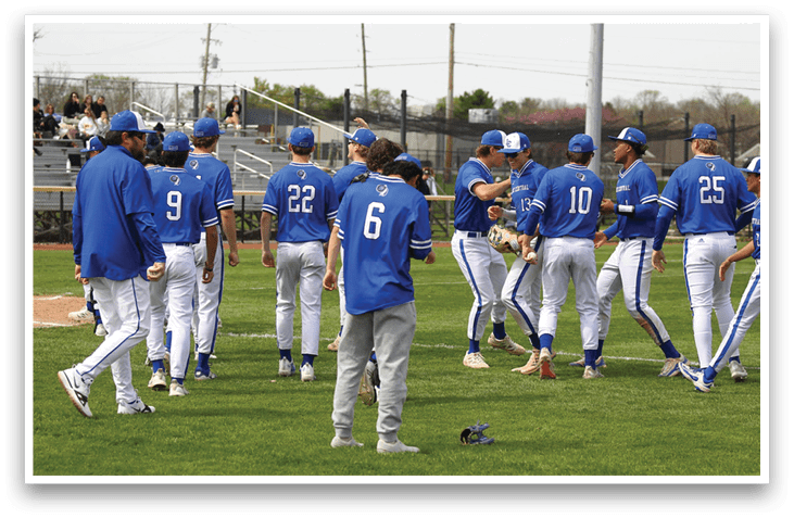 A group of baseball players wearing blue uniforms are standing on a field. AI generated content