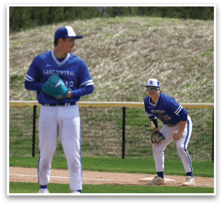A baseball player in a blue uniform stands on the pitcher's mound, holding a baseball glove. AI generated content