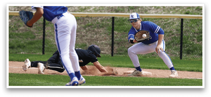 A baseball player in a blue uniform is sliding into a base while another player in a black uniform tries to catch the ball. AI generated content