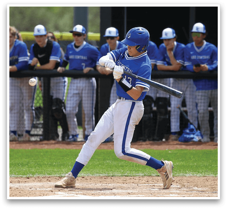 A baseball player in a blue and white uniform is swinging a bat at a ball. AI generated content
