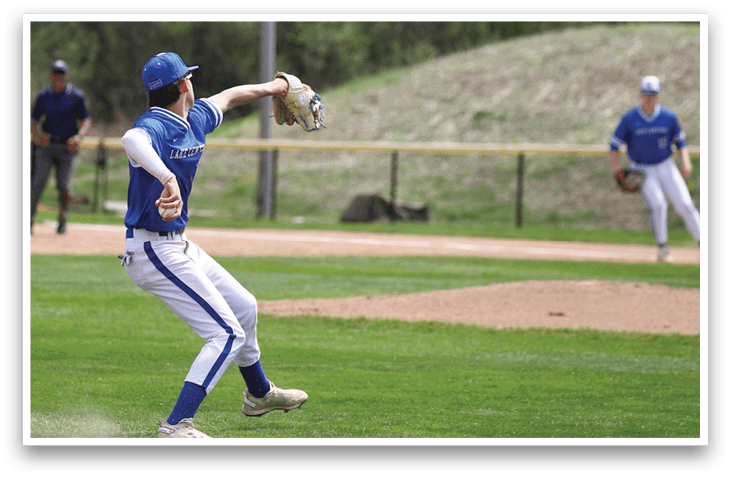 A baseball player in a blue and white uniform is throwing a ball. AI generated content