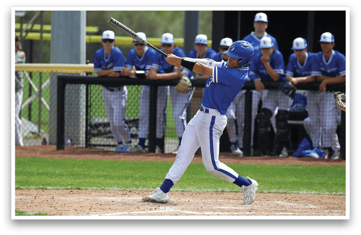A baseball player in a blue uniform is swinging a bat, with several other players watching from the dugout. AI generated content