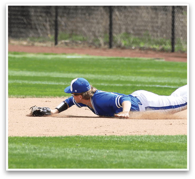 A baseball player slides into a base, wearing a blue and white uniform. AI generated content