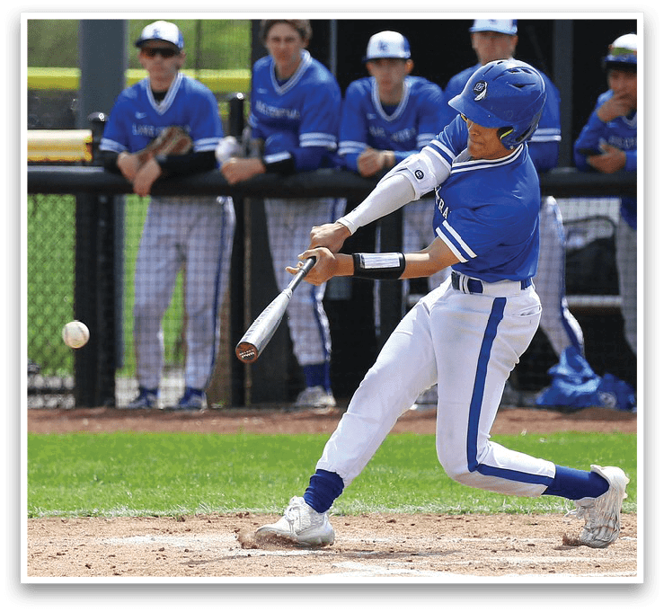 A baseball player in a blue uniform is swinging a bat at a ball. AI generated content