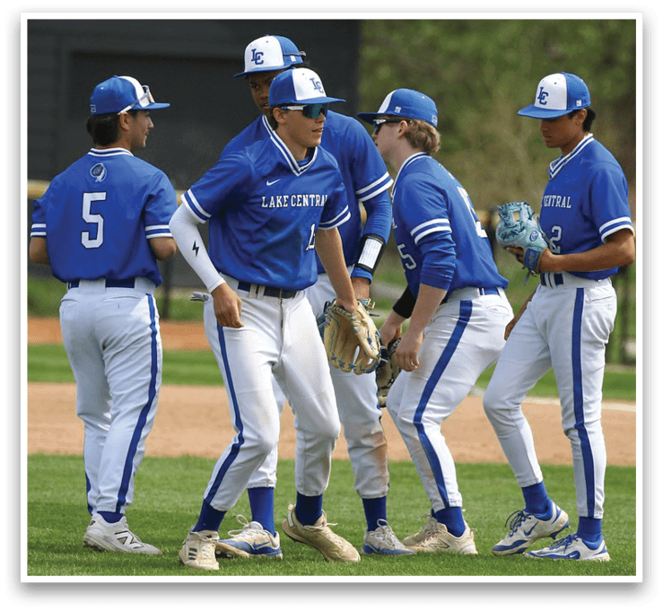 A group of baseball players wearing blue uniforms and blue hats are standing on a field. AI generated content