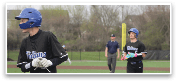 Two baseball players are on the field, one running towards the base while the other is walking away. AI generated content