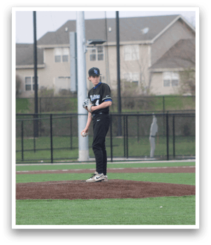 A baseball player is standing on the pitcher's mound, holding a baseball in his hand. AI generated content