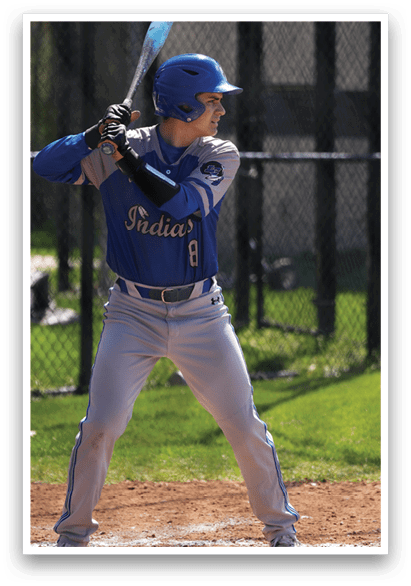 A baseball player in a blue and grey uniform is holding a bat and getting ready to swing at a pitch. AI generated content