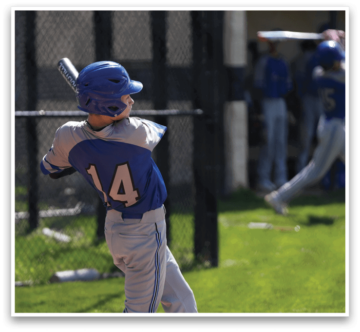 A baseball player in a blue helmet is swinging a bat, attempting to hit a ball. AI generated content