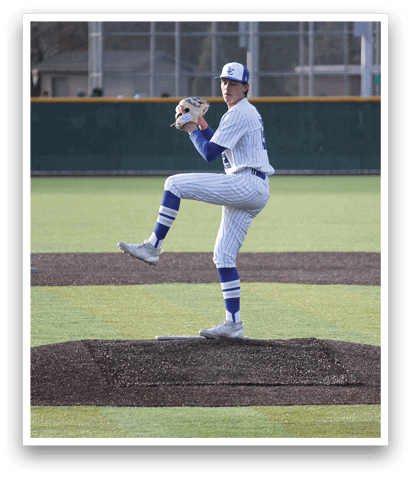 A baseball player in a white and blue uniform is in the process of throwing a ball. AI generated content