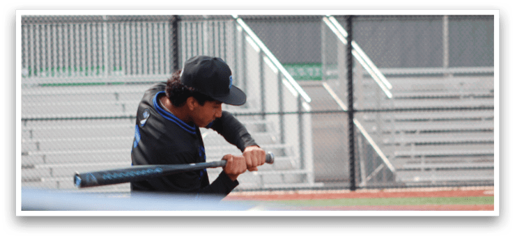 A man is swinging a baseball bat on a baseball field. AI generated content