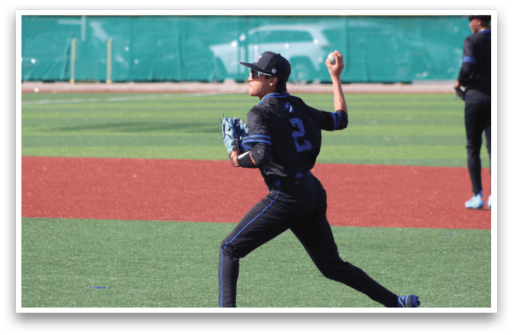 A baseball player in a black and blue uniform is throwing a ball on a field. AI generated content